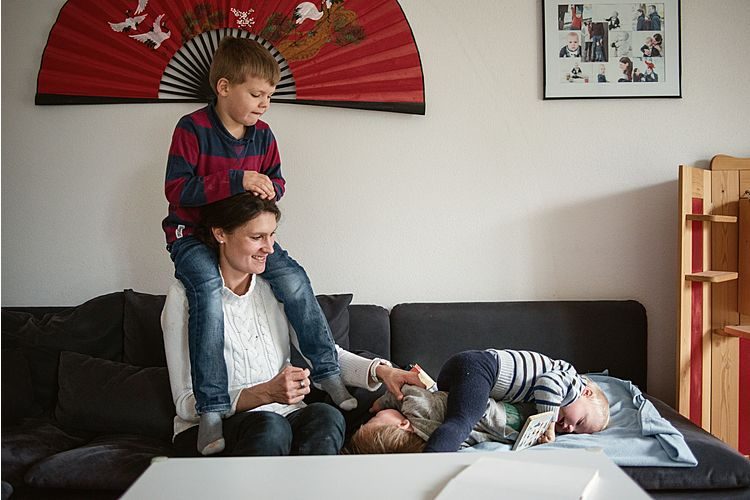 Corinne Wyss with her two sons and her foster son Nico.